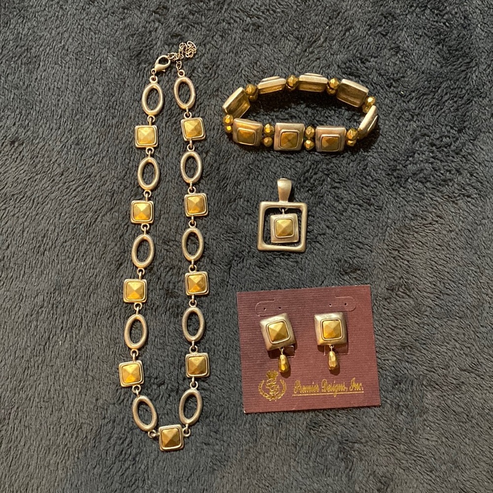 Premier Designs matching necklace, bracelet, pendant and earrings set.